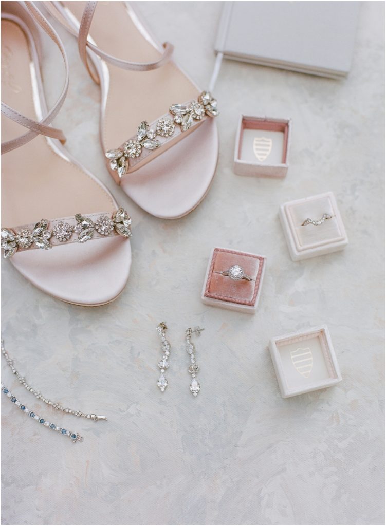 soft pastel bridal details including a Mrs. box, vow book and shoes
