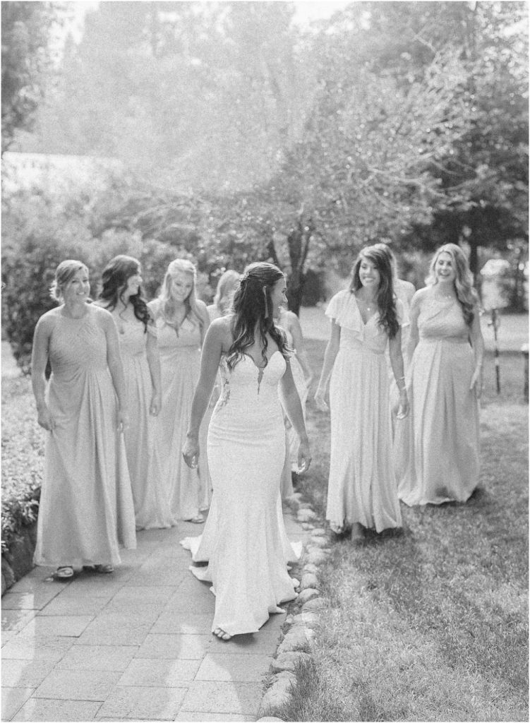 Bridesmaids adore over their bride at a twenty mile house wedding