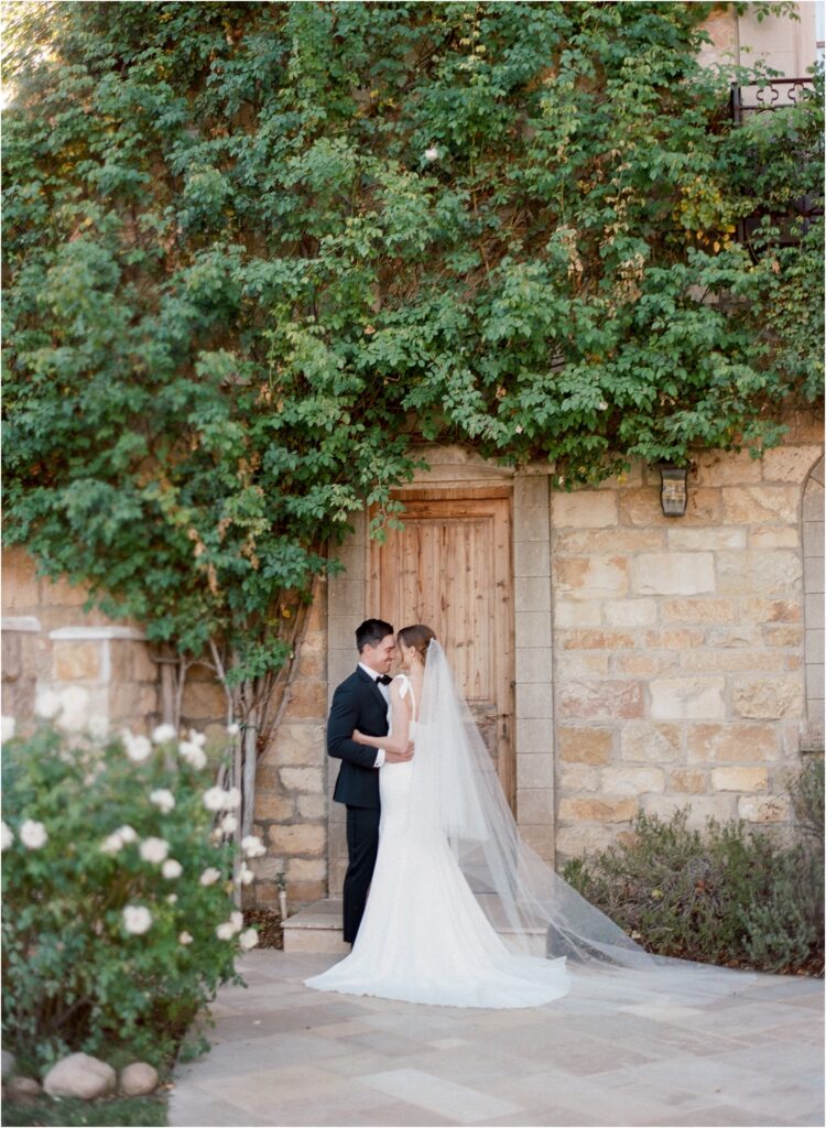 A summer Sunstone Winery wedding drenched in purple clematis